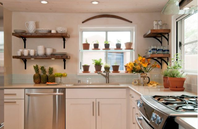 Open kitchen shelves next to the window