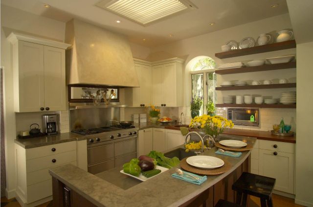 Open shelves in the kitchen for storing dishes and decor.