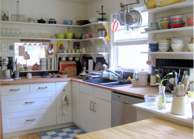 White floating corner open kitchen shelves