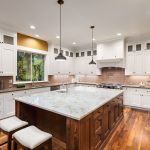 White Kitchen with Dark Island with cabinets