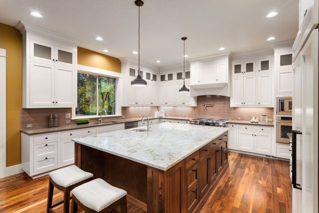 White Kitchen with Dark Island with cabinets